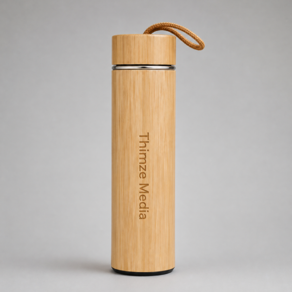 Bamboo insulated flask with "Thimze Media" laser-engraved vertically on the body and a leather loop lid